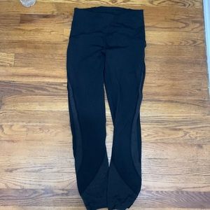 Lululemon leggings. Black size 4 with floral trim detail